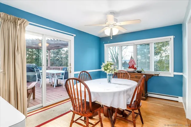 a living room with furniture fireplace and a large window