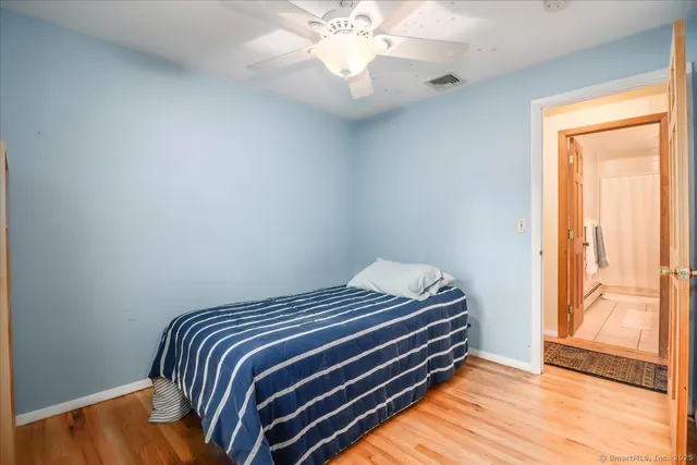 a bedroom with a bed and a dresser