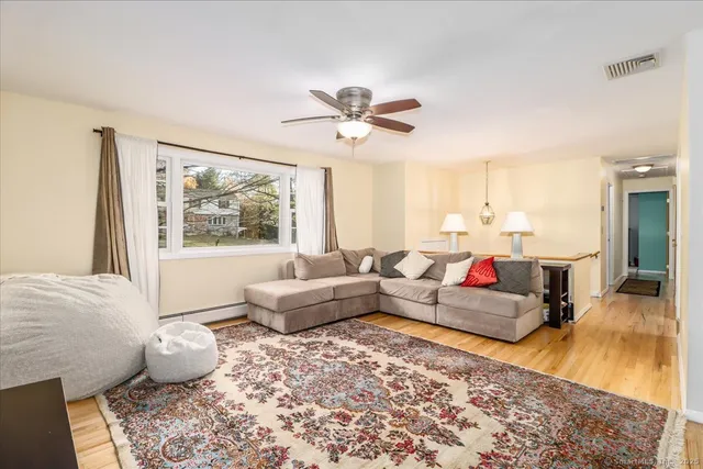 a living room with furniture and a rug