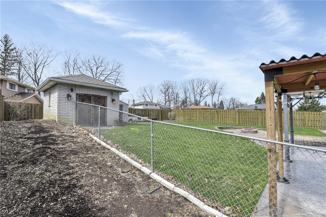 7350 Ames Road Parma, OH 44130 - Photo 43 of 50 A view of the back of the dog run, toward the yard and outbuilding