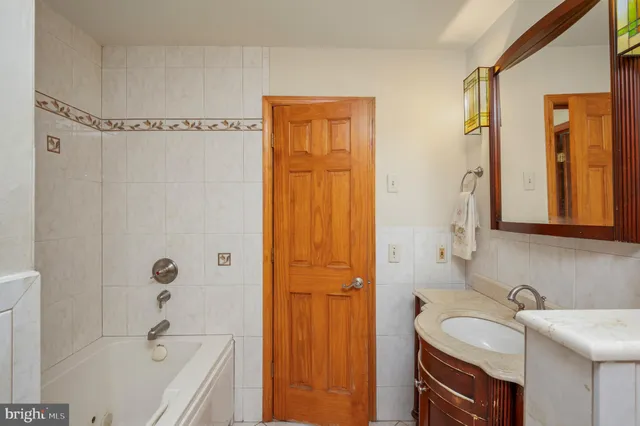 a bedroom with furniture and a rug