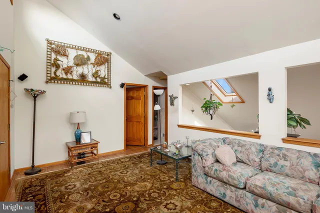 an aerial view of a house with a lake view