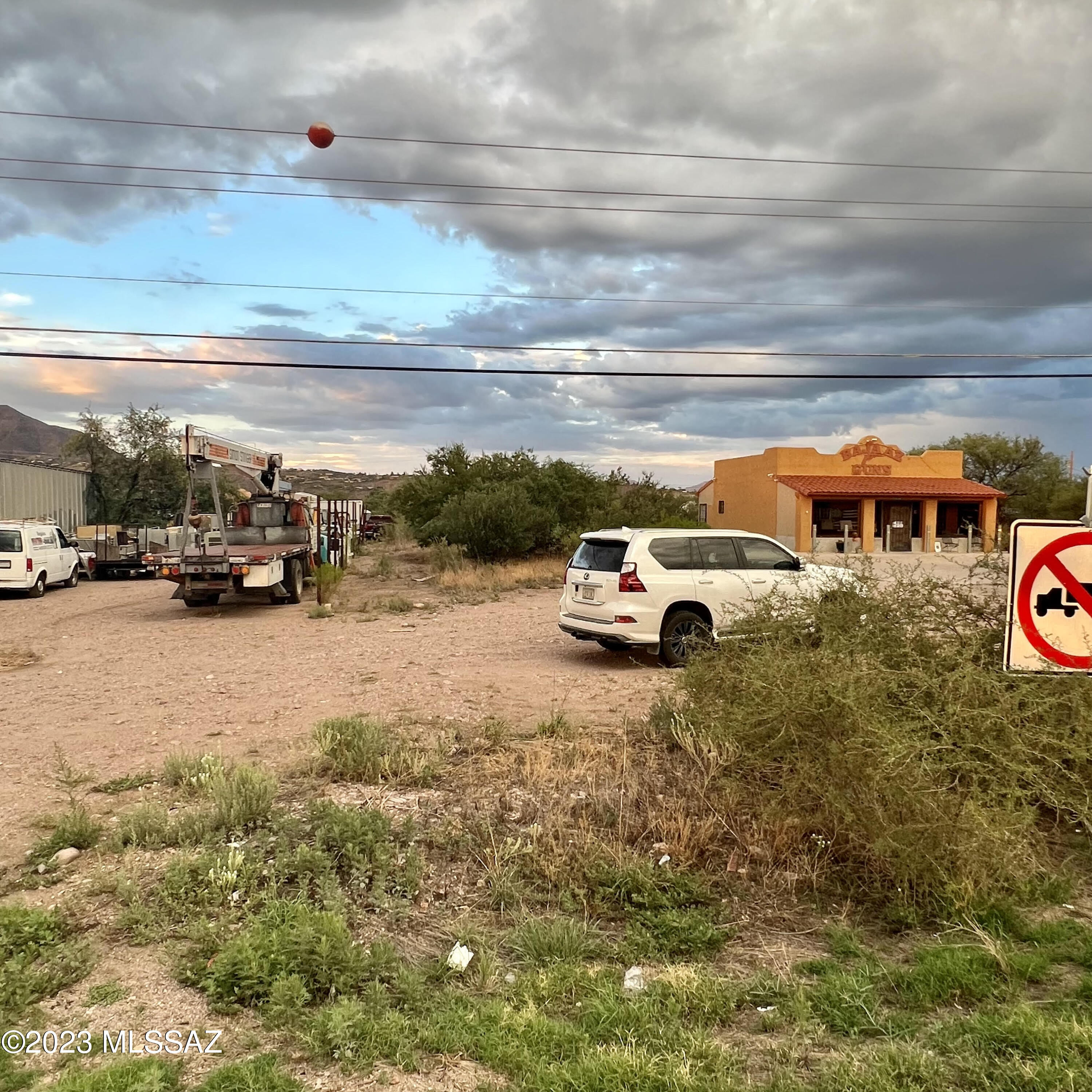 1217 West Frontage Road Rio Rico, AZ 85648 - Photo 3 of 18 a view of parking with cars parked