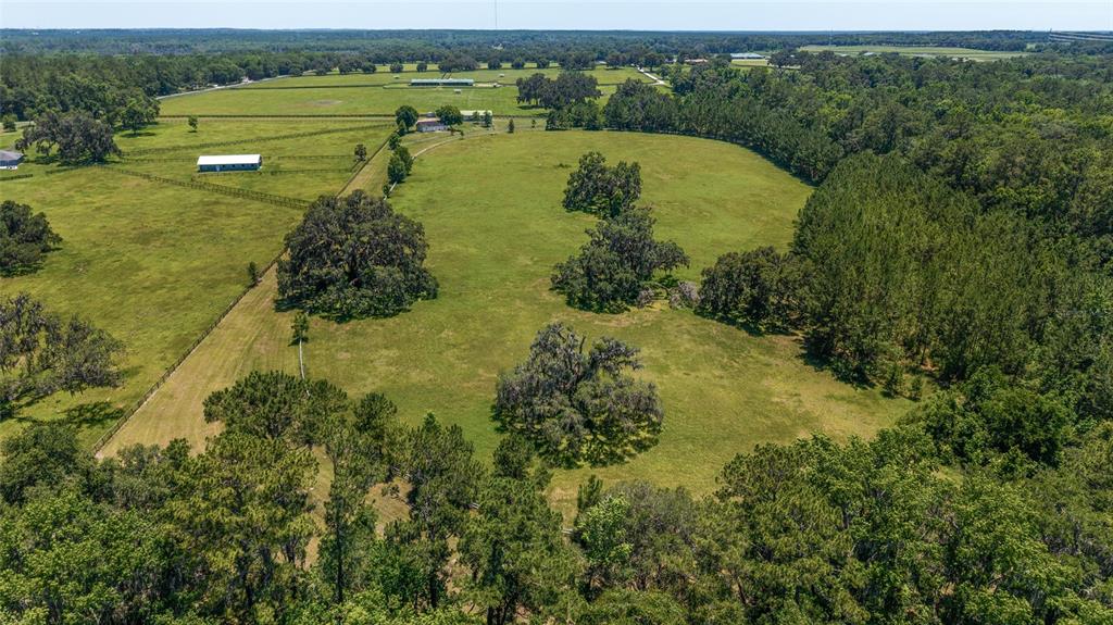 16490 Northwest 122nd Terrace Reddick, FL 32686 - Photo 24 of 24 a view of a lake with a mountain in the background