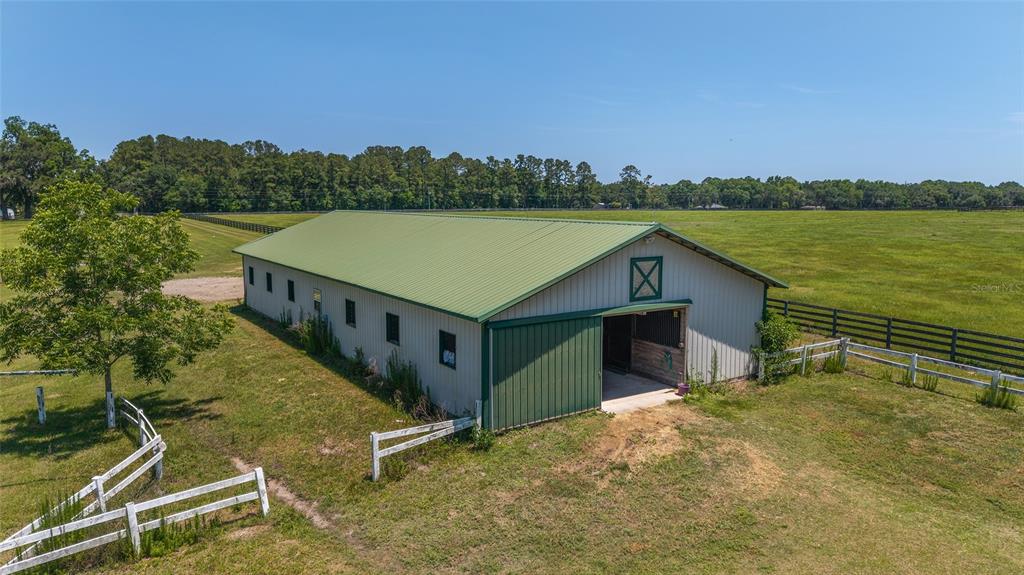 16490 Northwest 122nd Terrace Reddick, FL 32686 - Photo 4 of 24 a view of a terrace with a lake view