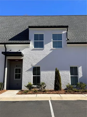 a house with palm tree in front of it