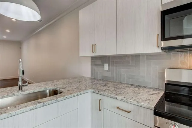 a open kitchen with a table and chairs in it