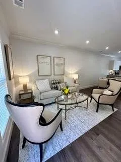 a open kitchen with white cabinets and stainless steel appliances