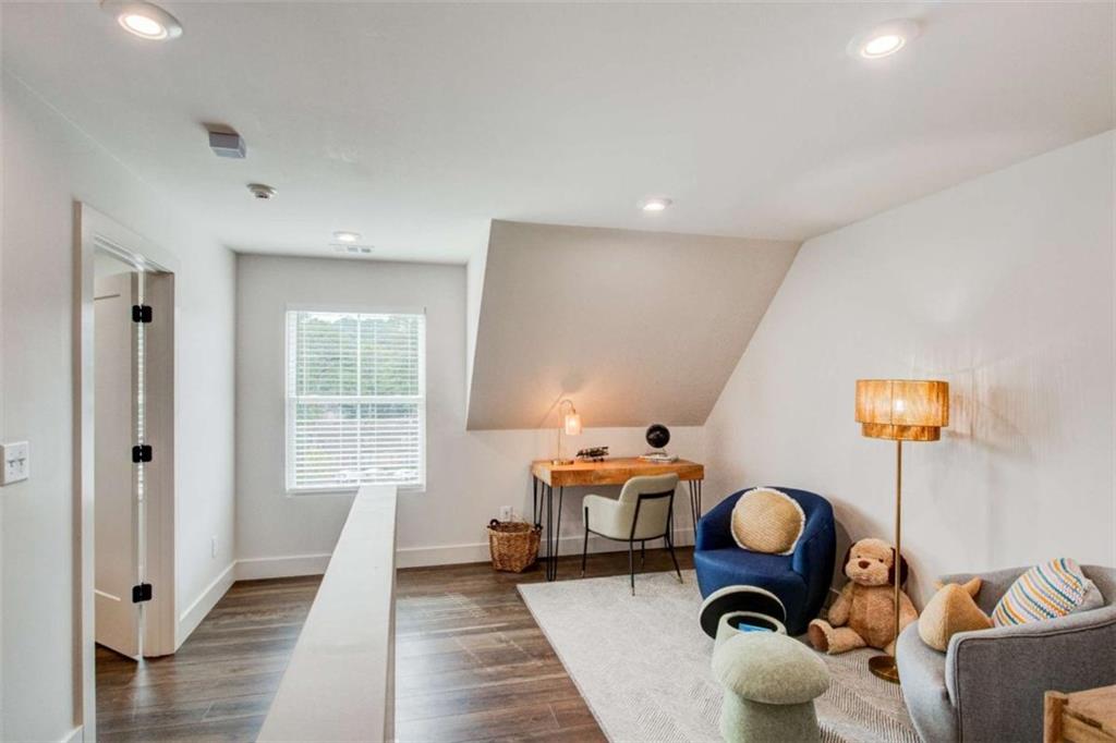 105 Chateau Drive Southeast Rome, GA 30161 - Photo 37 of 49 a living room with furniture a rug and a large window