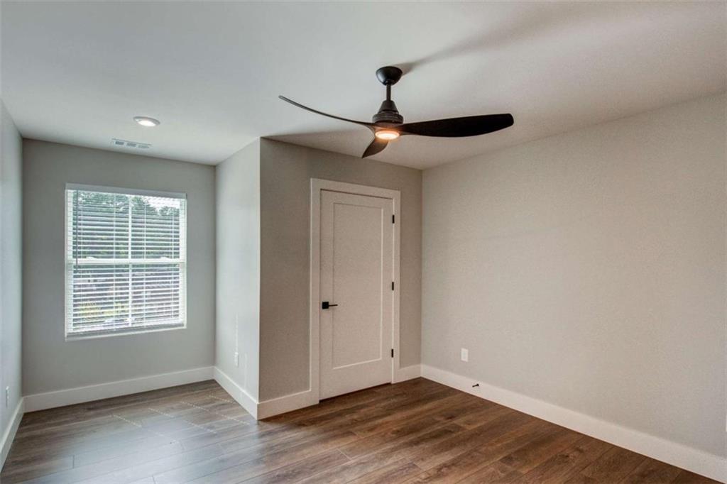 105 Chateau Drive Southeast Rome, GA 30161 - Photo 44 of 49 a view of an empty room with wooden floor and a window