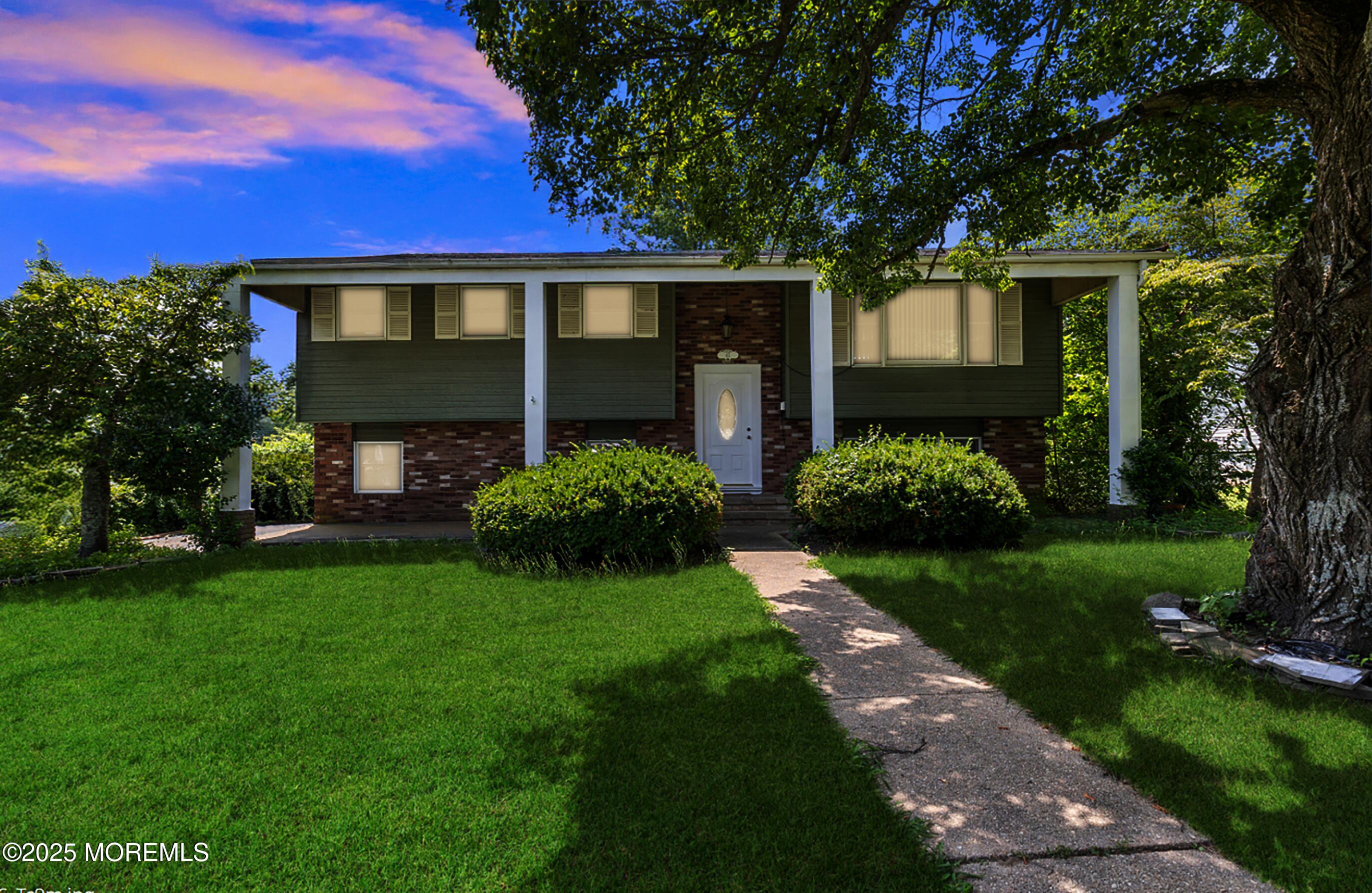 47 Valley Road Jackson, NJ 08527 - Photo 1 of 29 a front view of a house with garden