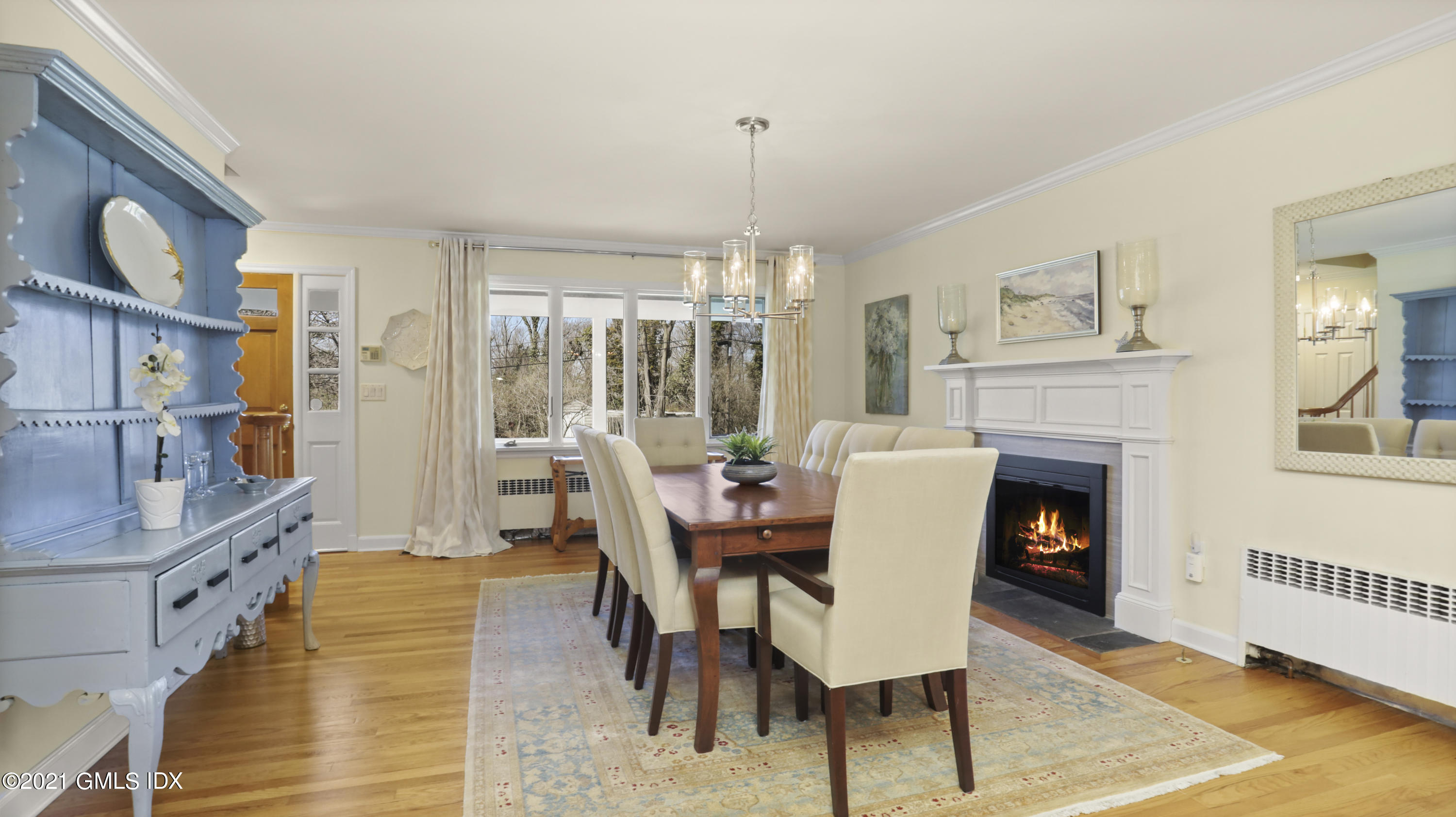 4 Norias Road Greenwich, CT 06830 - Photo 11 of 44 a dining room with furniture window and wooden floor