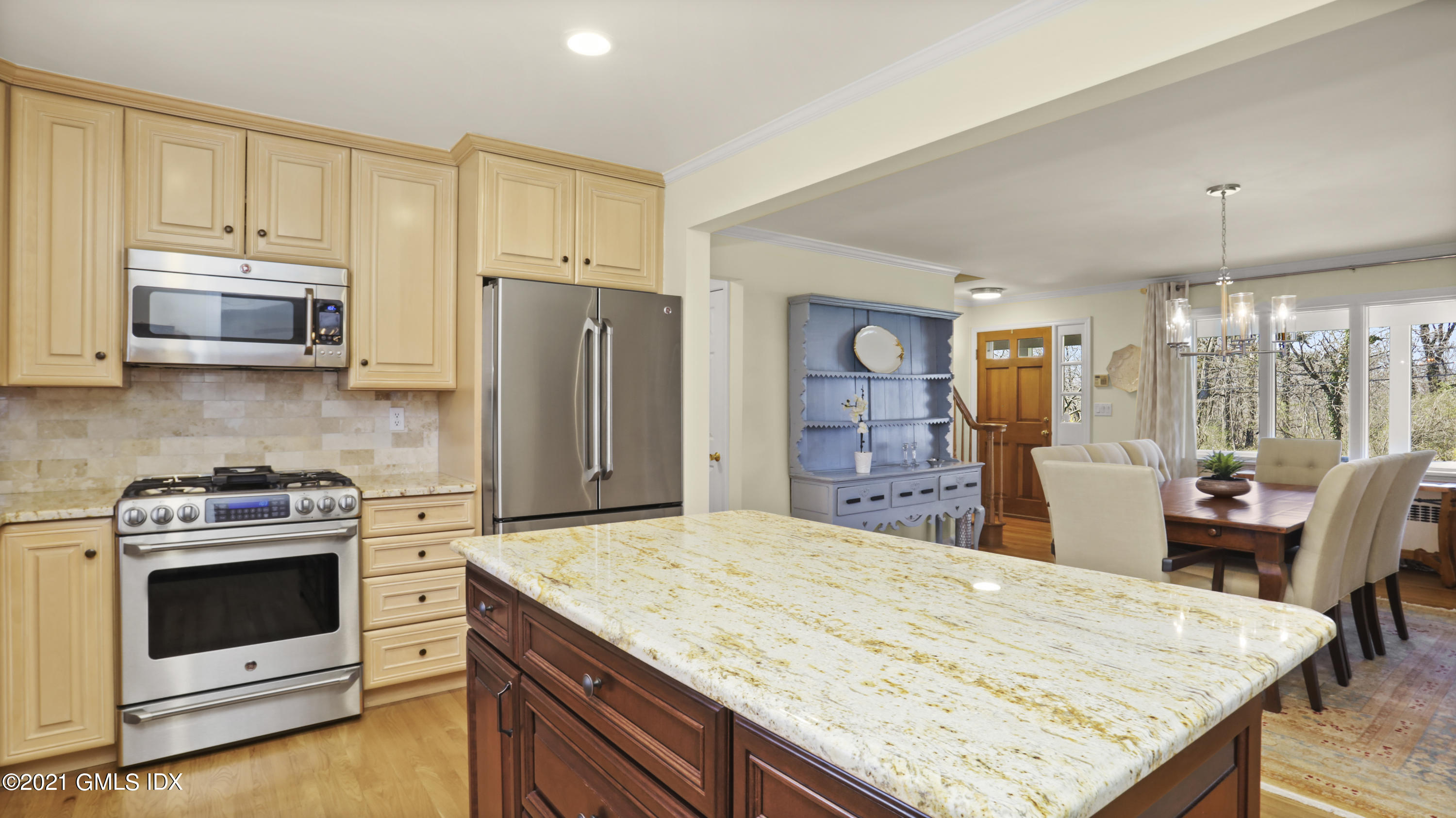 4 Norias Road Greenwich, CT 06830 - Photo 18 of 44 a kitchen with a stove a sink and a refrigerator