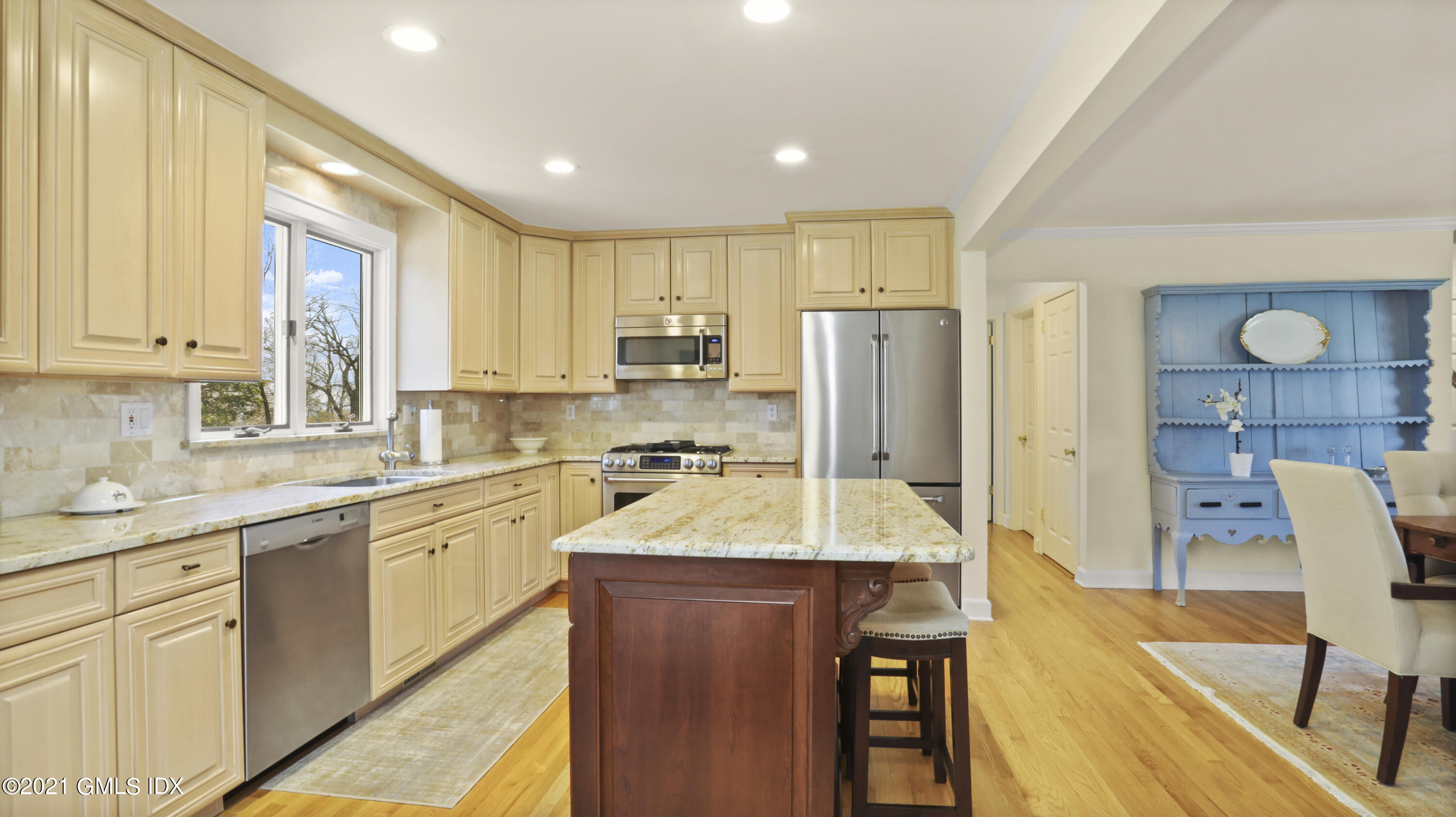4 Norias Road Greenwich, CT 06830 - Photo 19 of 44 a kitchen with stainless steel appliances granite countertop sink refrigerator and cabinets