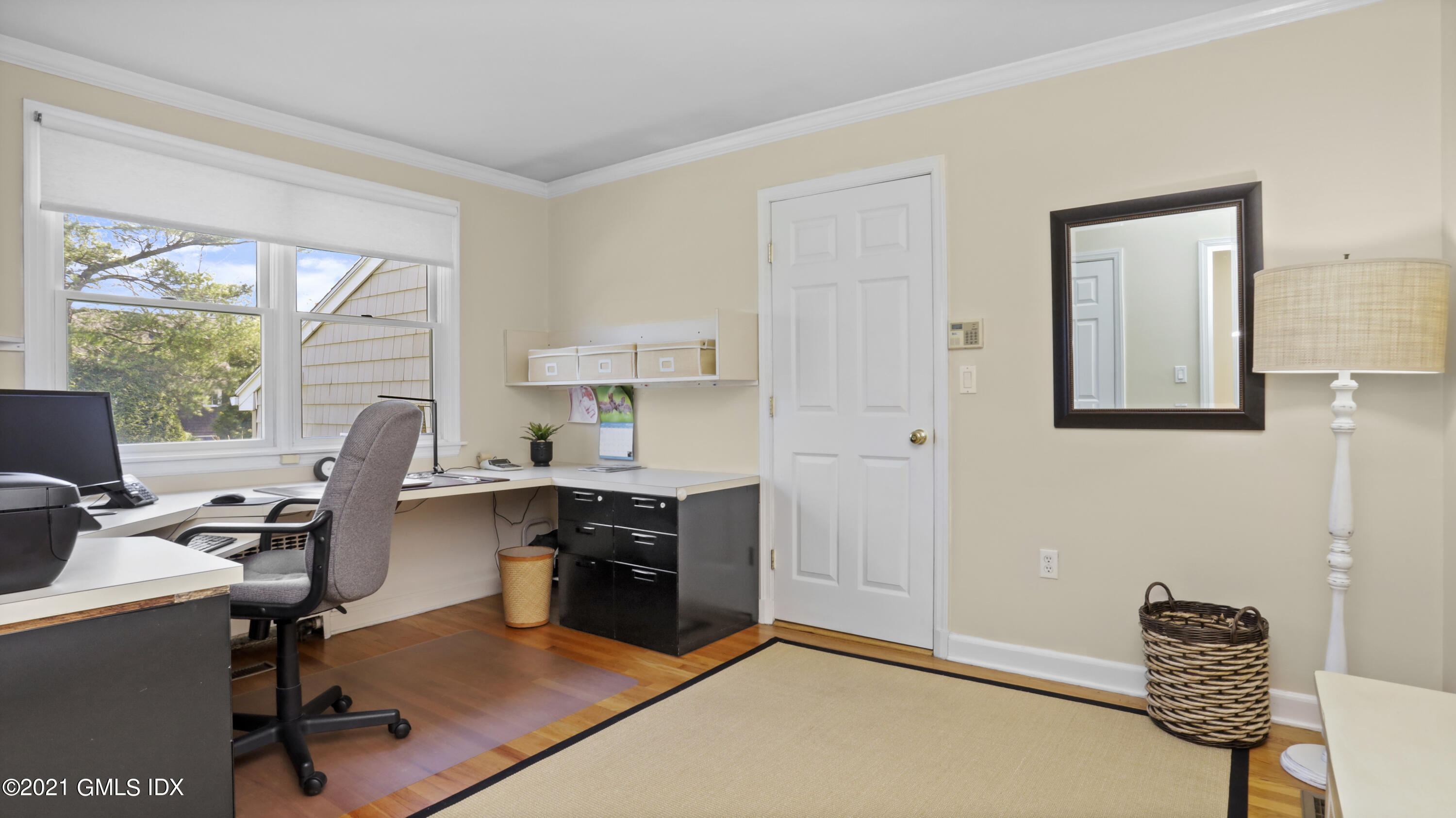 4 Norias Road Greenwich, CT 06830 - Photo 24 of 44 a view of a workspace with furniture and a window