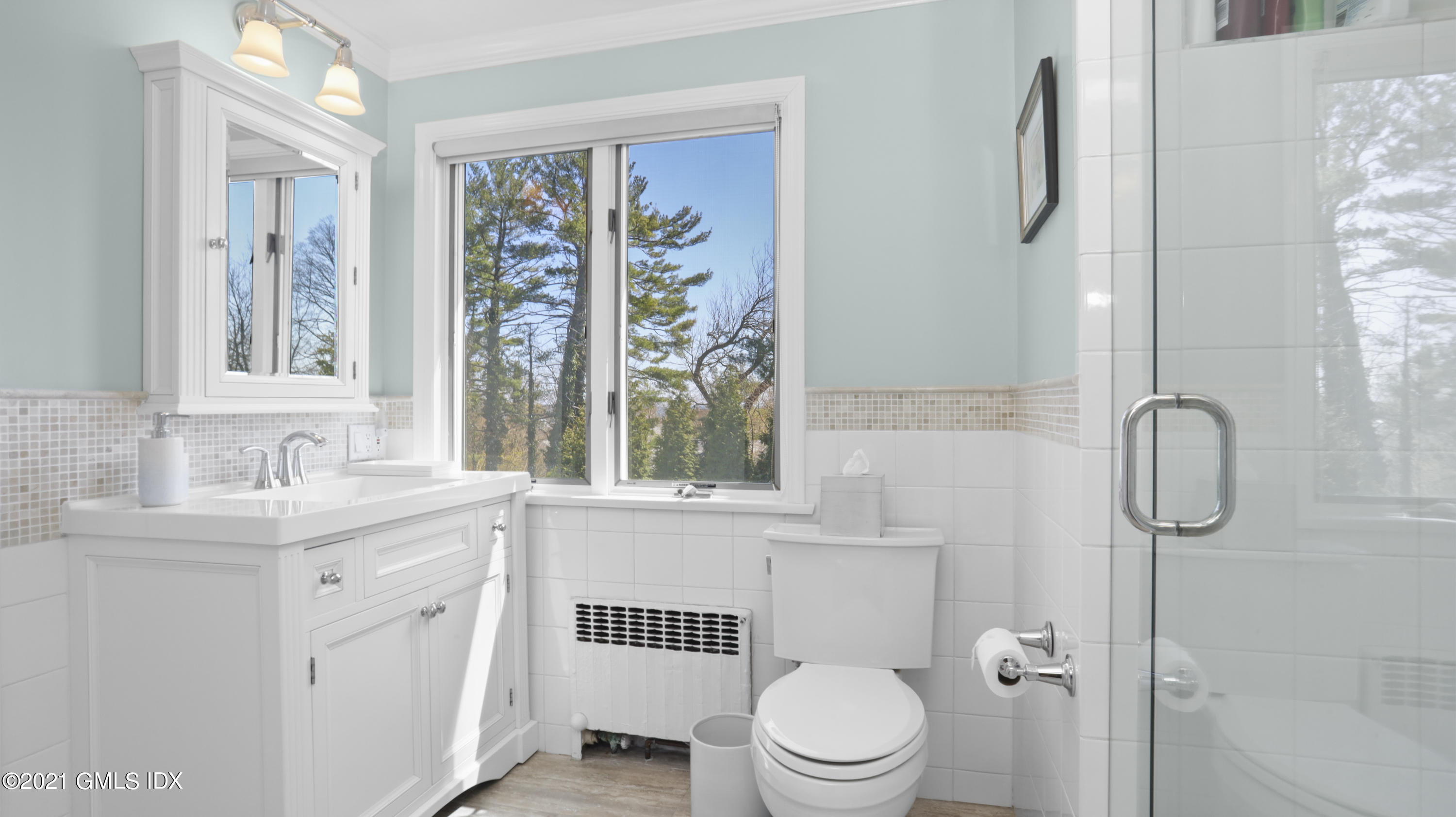 4 Norias Road Greenwich, CT 06830 - Photo 29 of 44 a bathroom with a sink a toilet and shower