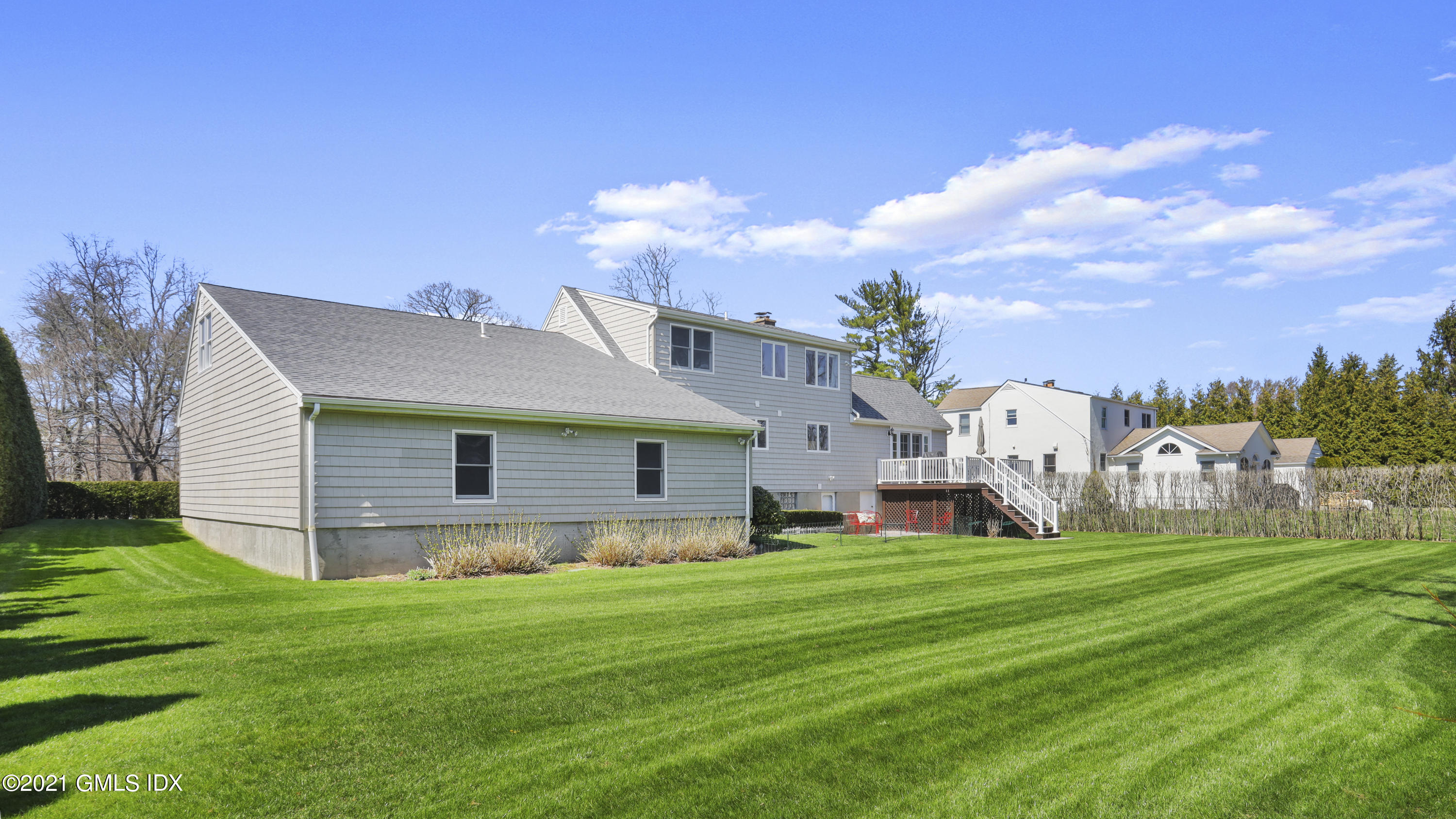 4 Norias Road Greenwich, CT 06830 - Photo 42 of 44 a view of a house with a yard and sitting area
