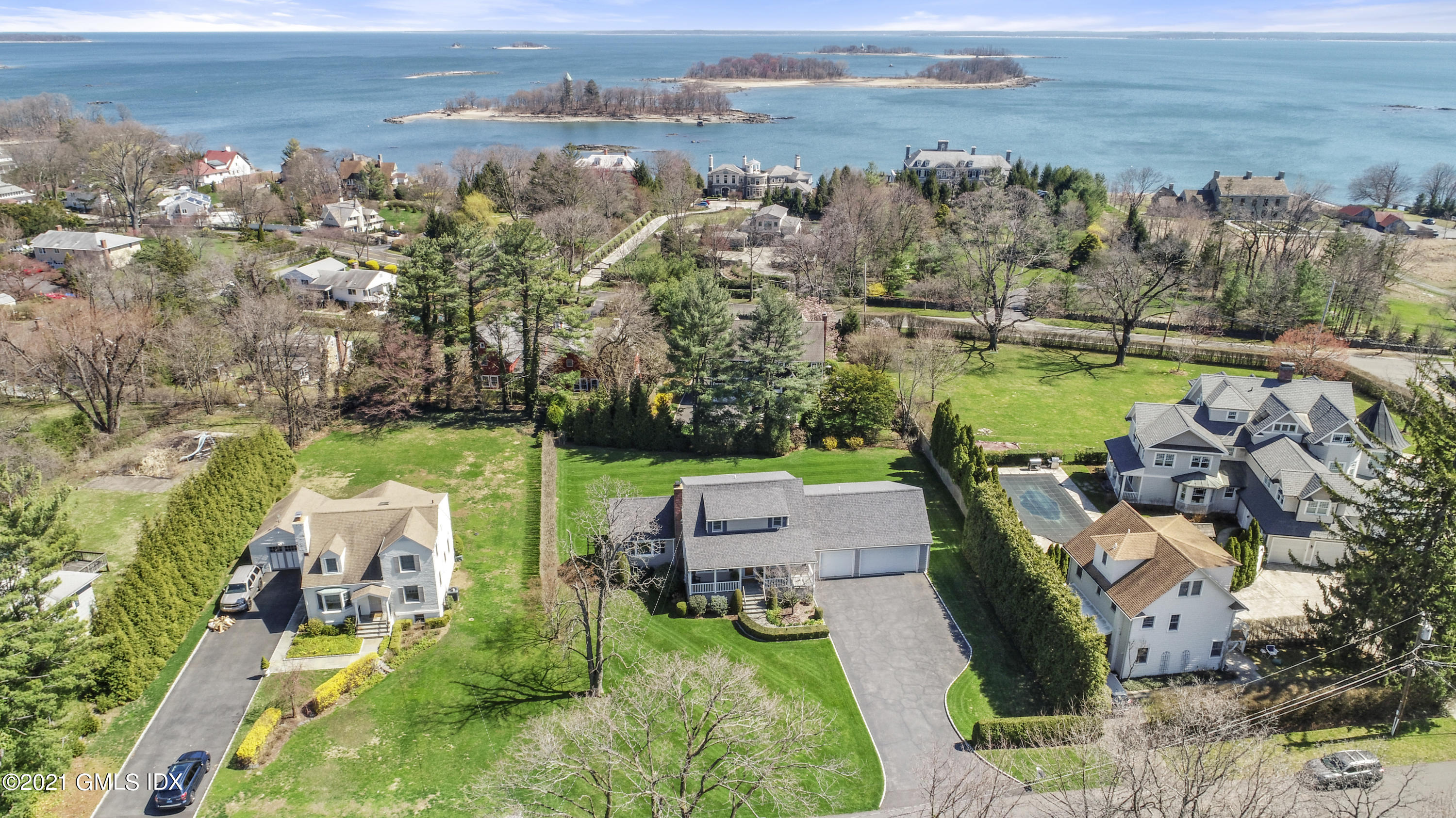 4 Norias Road Greenwich, CT 06830 - Photo 44 of 44 an aerial view of a house with a garden and lake view