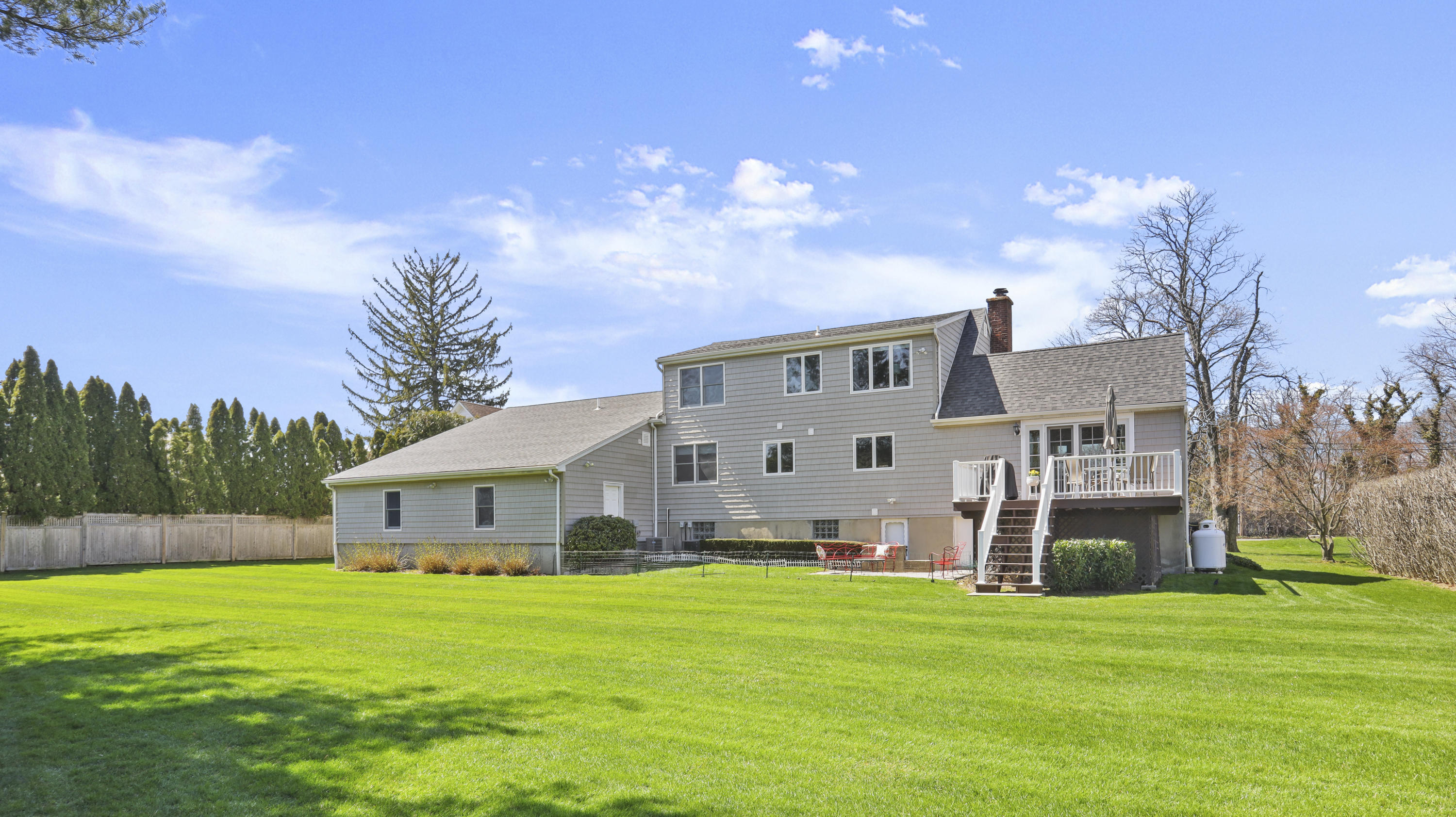 4 Norias Road Greenwich, CT 06830 - Photo 5 of 44 a front view of house with yard and green space
