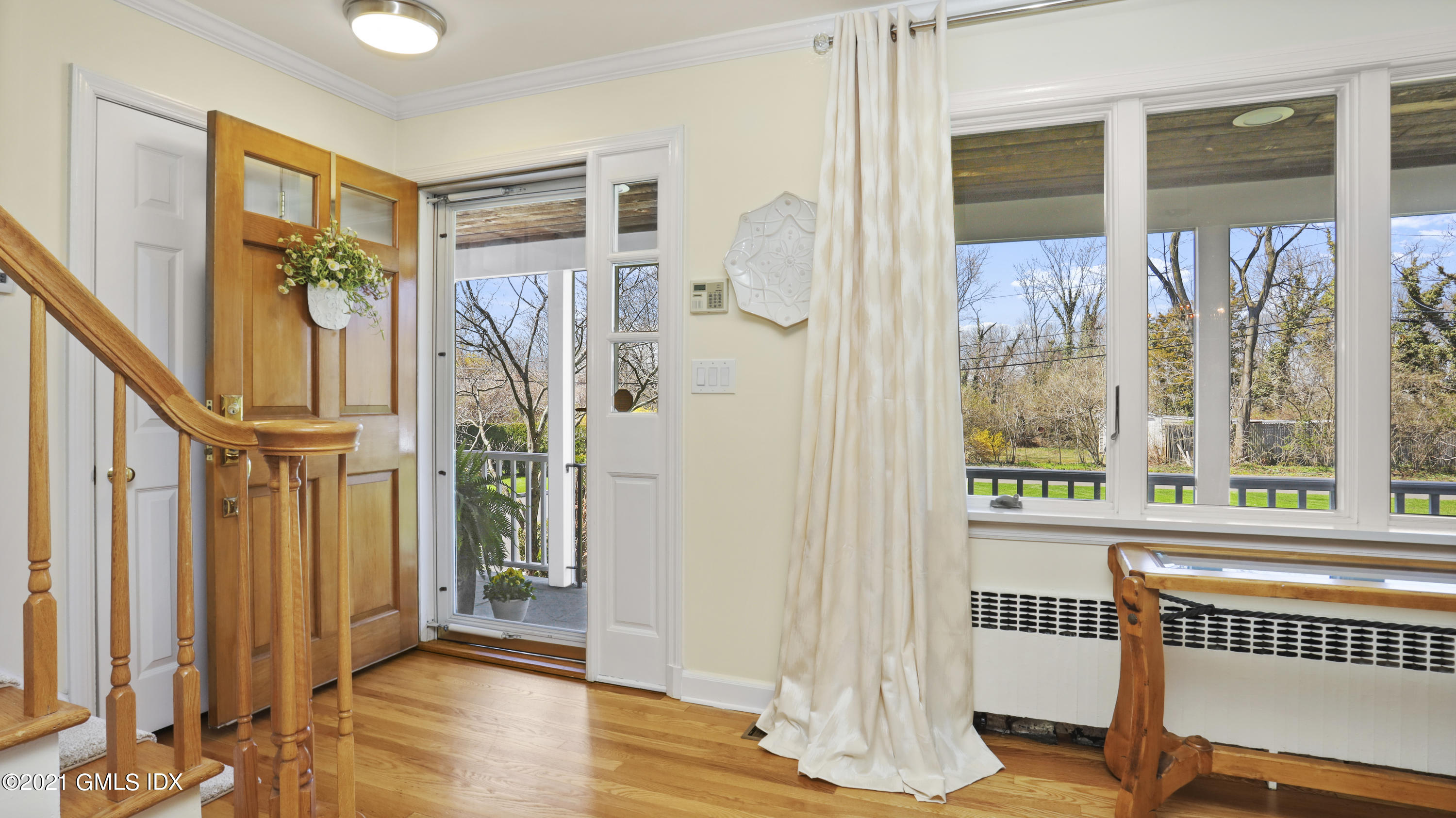 4 Norias Road Greenwich, CT 06830 - Photo 10 of 44 a view of an entryway with wooden floor and door