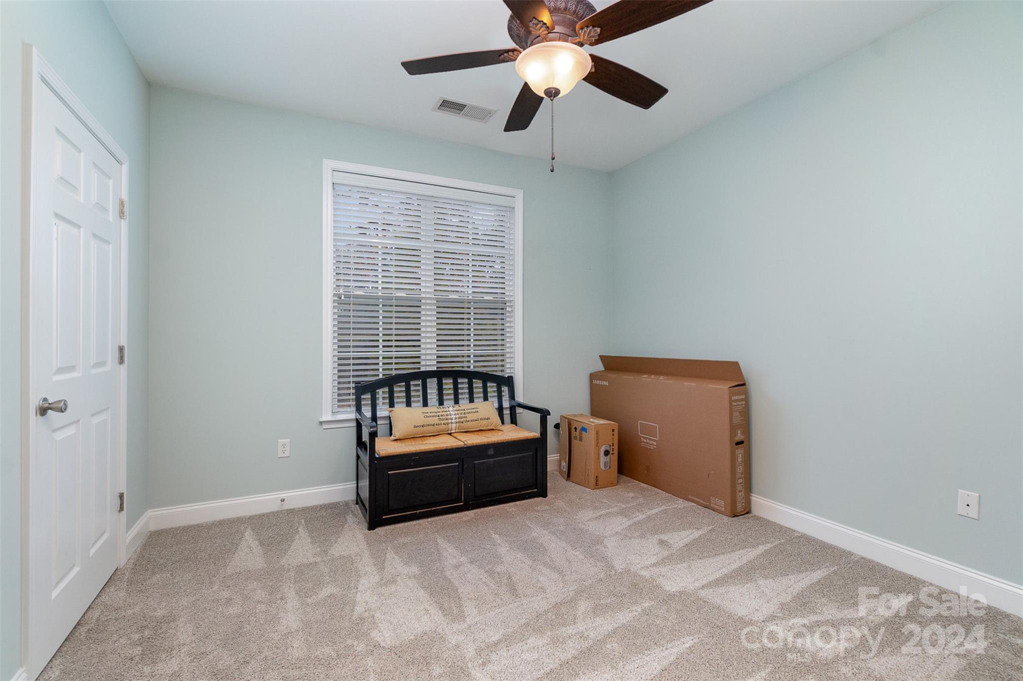 8653 Edinburgh Square Drive Cornelius, NC 28031 - Photo 16 of 22 a bedroom with a bed and a window