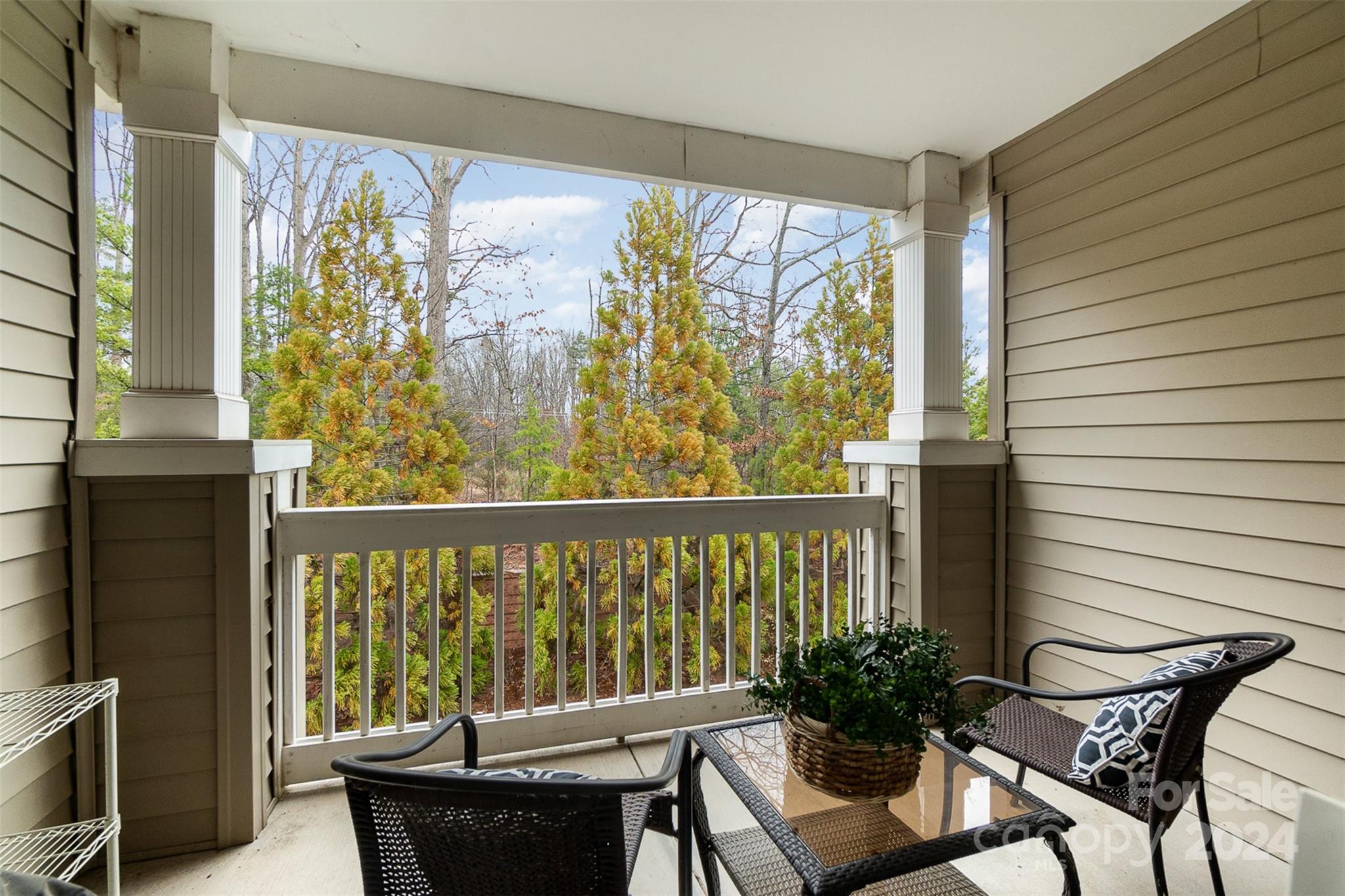 8653 Edinburgh Square Drive Cornelius, NC 28031 - Photo 18 of 22 a view of a porch with furniture and wooden floor