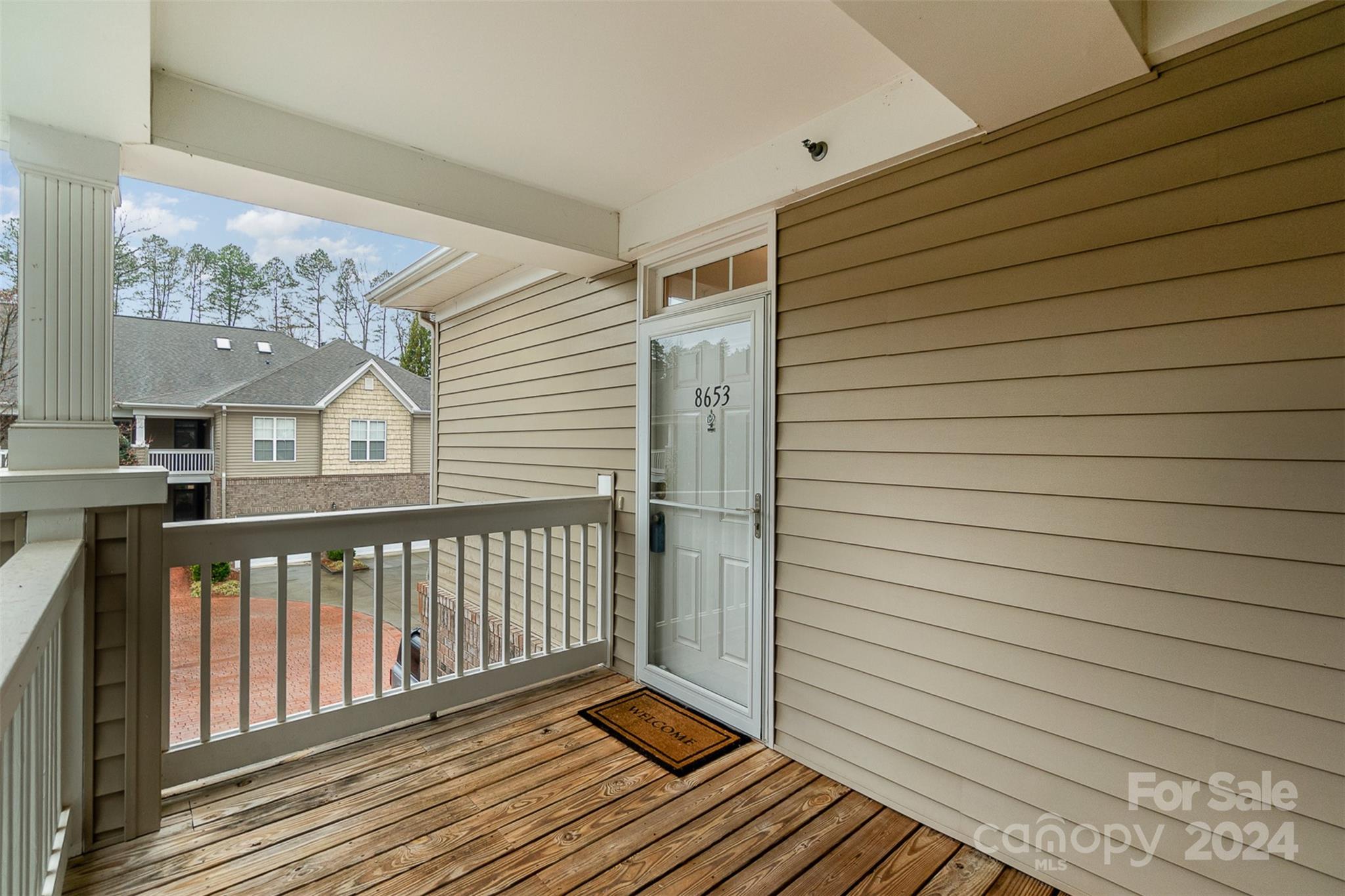 8653 Edinburgh Square Drive Cornelius, NC 28031 - Photo 19 of 22 a view of a balcony with wooden floor