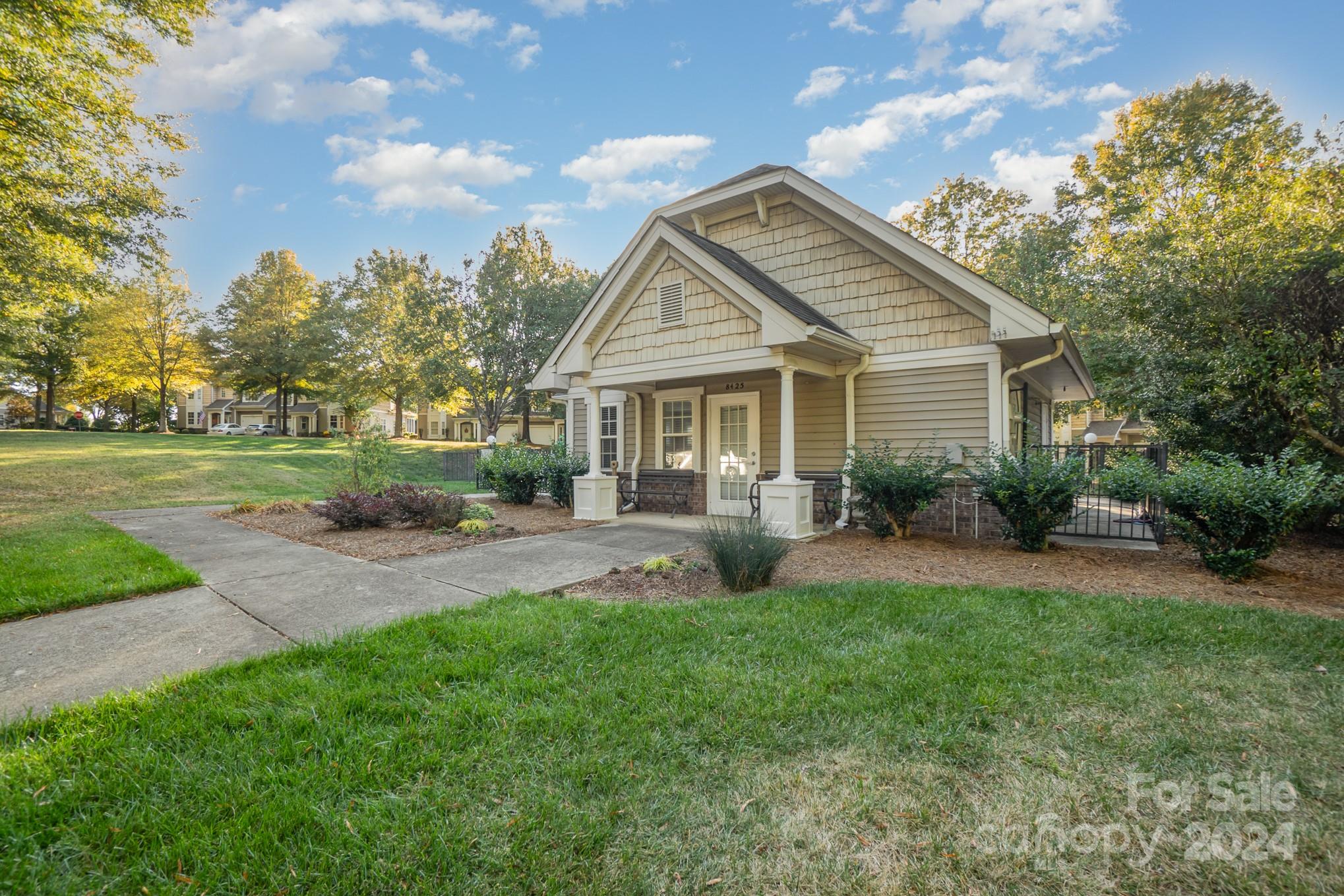 8653 Edinburgh Square Drive Cornelius, NC 28031 - Photo 20 of 22 a front view of house with yard and green space