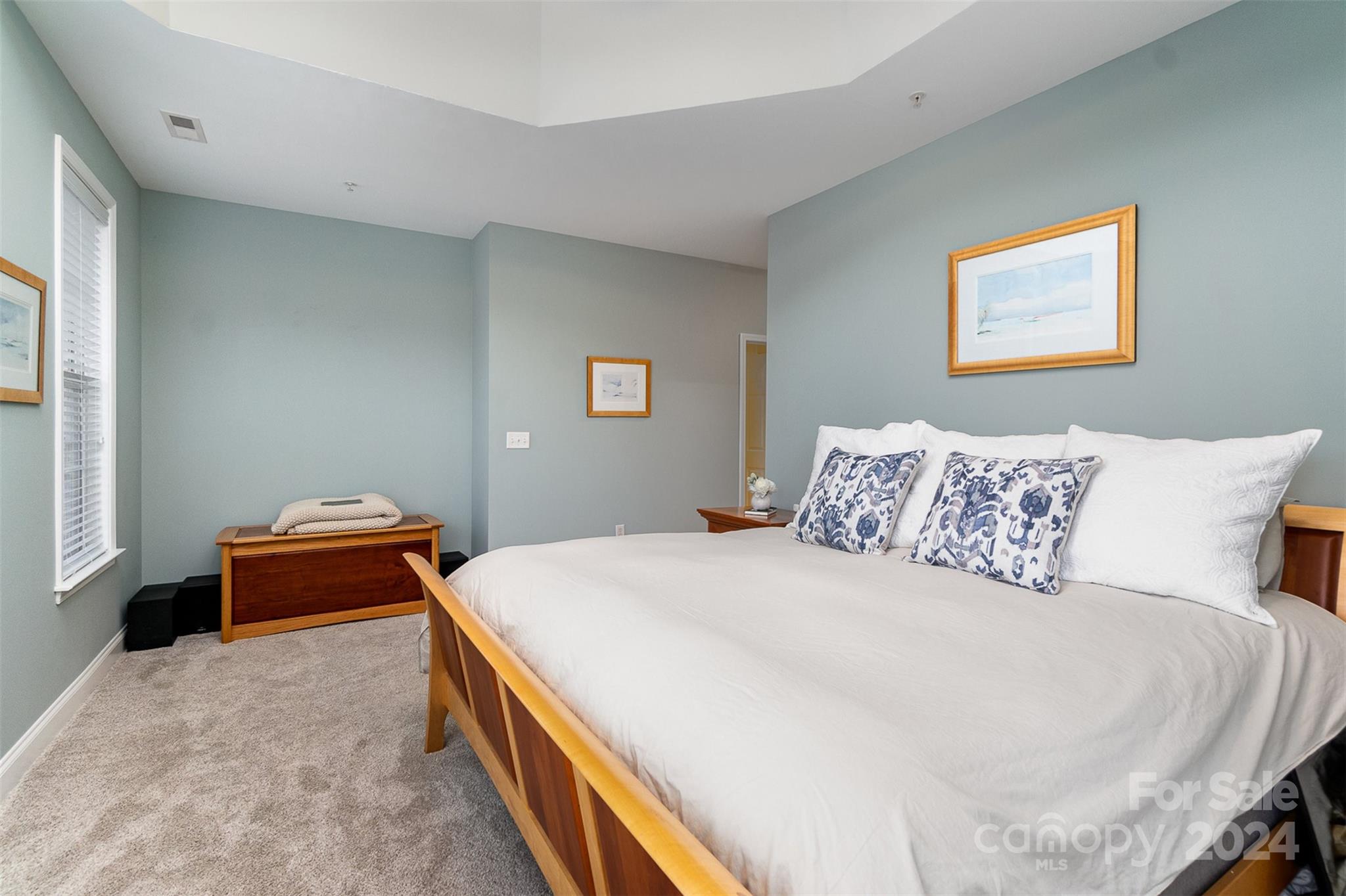 8653 Edinburgh Square Drive Cornelius, NC 28031 - Photo 5 of 22 a spacious bedroom with a bed and a couch