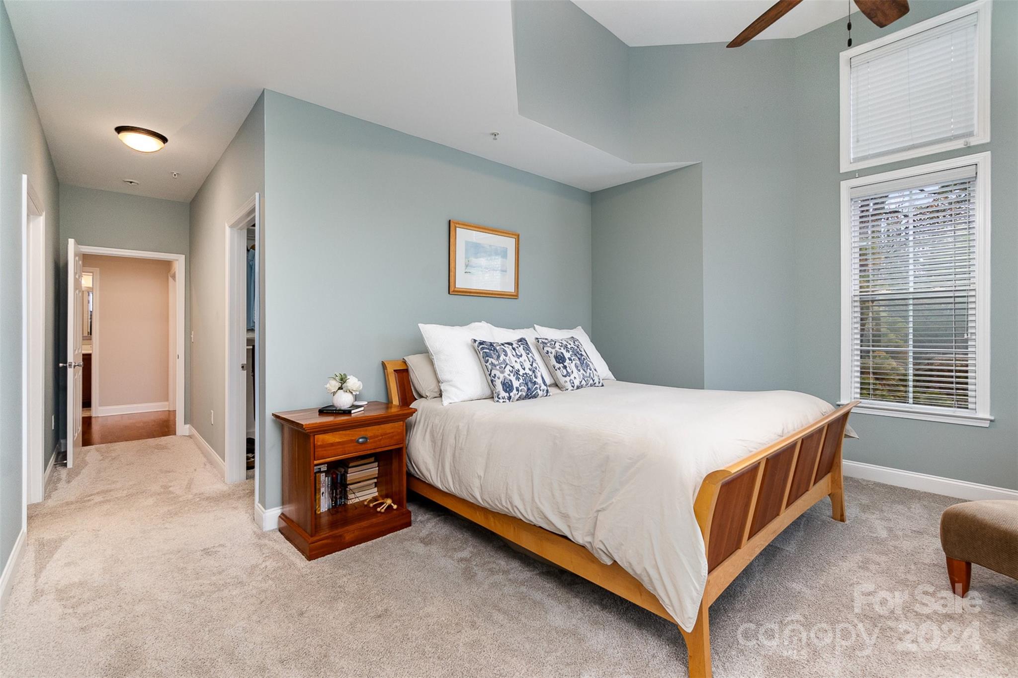 8653 Edinburgh Square Drive Cornelius, NC 28031 - Photo 6 of 22 a bed sitting in a bedroom next to a window