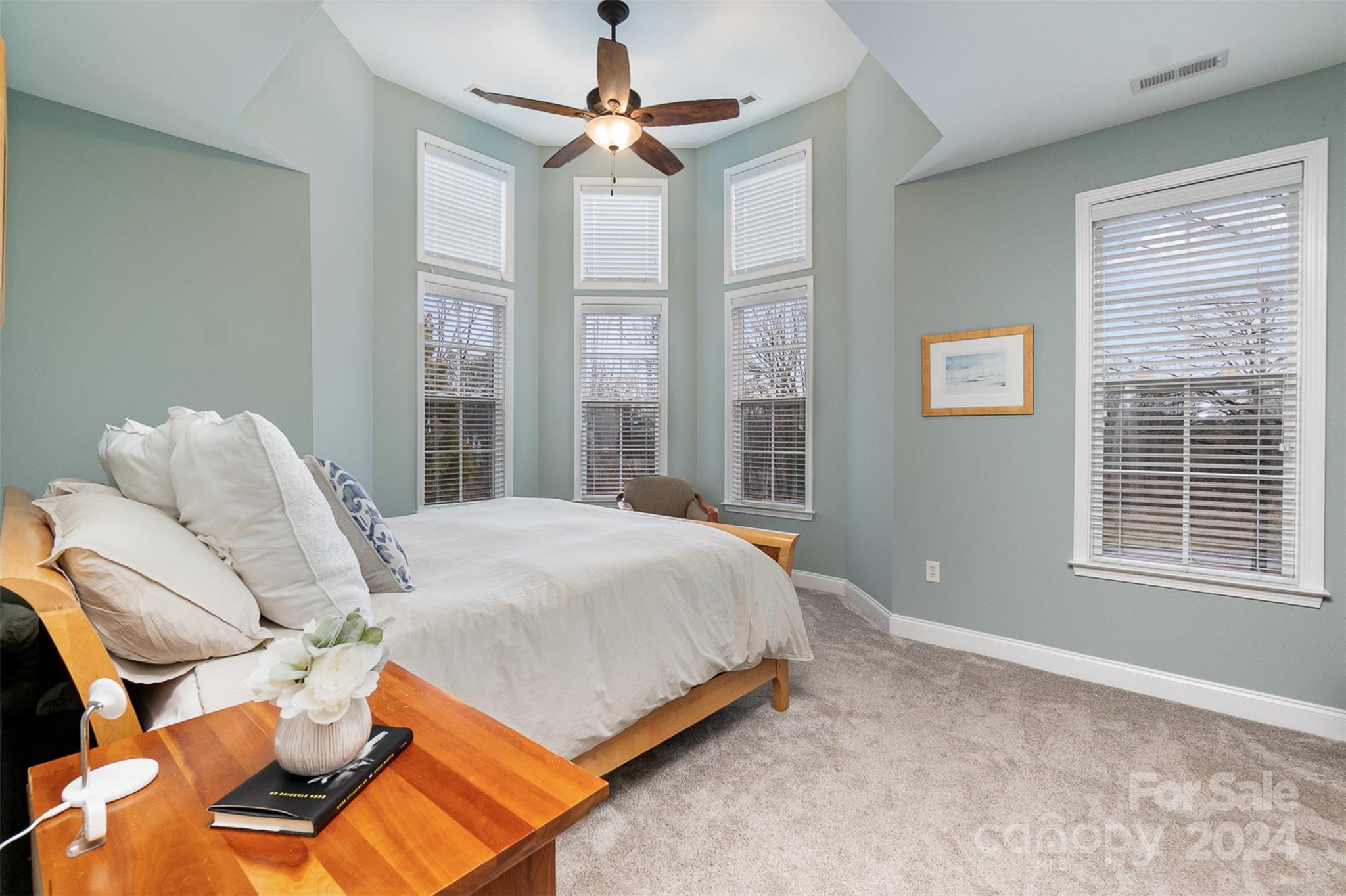 8653 Edinburgh Square Drive Cornelius, NC 28031 - Photo 7 of 22 a bed sitting in a bedroom next to a window