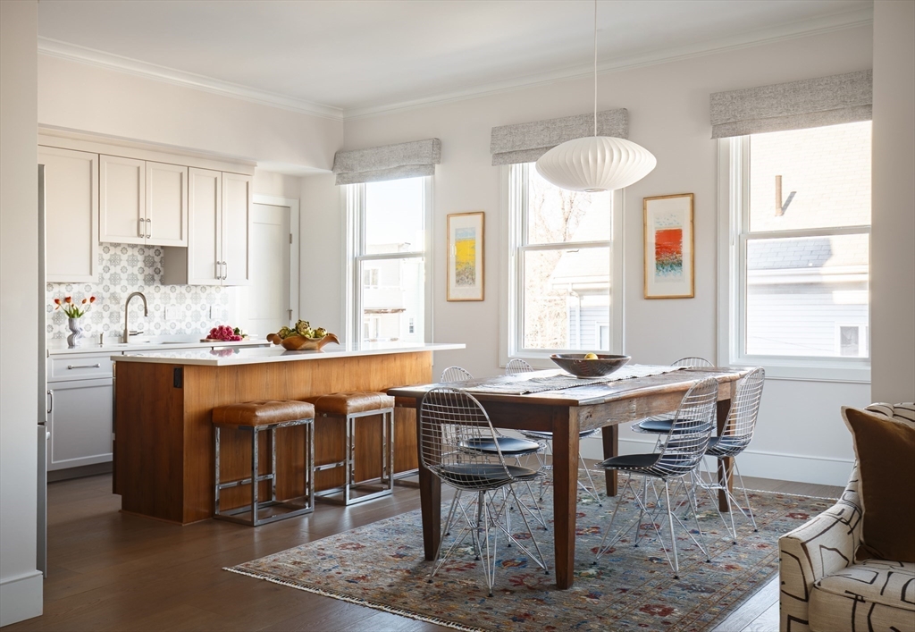 11 Tannery Brook Row, Unit 3 Somerville, MA 02144 - Photo 1 of 20 a view of a dining room with furniture and window