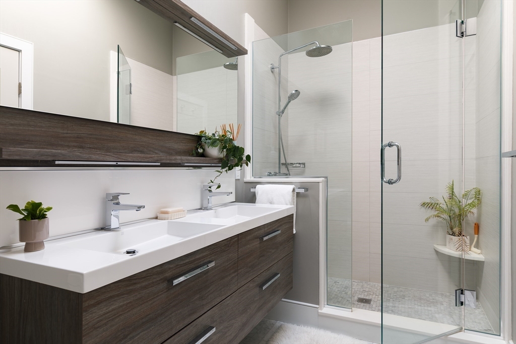 11 Tannery Brook Row, Unit 3 Somerville, MA 02144 - Photo 14 of 20 a bathroom with a sink and a mirror
