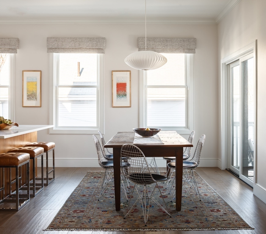 11 Tannery Brook Row, Unit 3 Somerville, MA 02144 - Photo 4 of 20 a view of a dining room with furniture and window