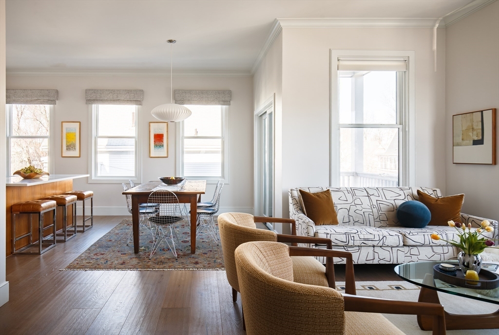 11 Tannery Brook Row, Unit 3 Somerville, MA 02144 - Photo 5 of 20 a living room with furniture and a wooden floor