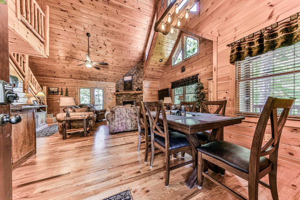 88 Black Gum Lane Blue Ridge, GA 30513 - Photo 13 of 85 a view of a patio with table and chairs with wooden floor and fence