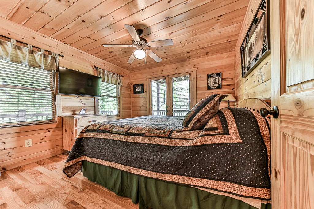 88 Black Gum Lane Blue Ridge, GA 30513 - Photo 25 of 85 a bedroom with furniture and a flat screen tv