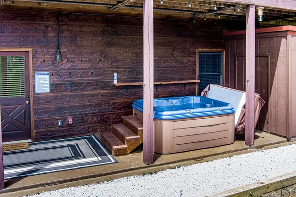a backyard of a house with a yard and outdoor seating