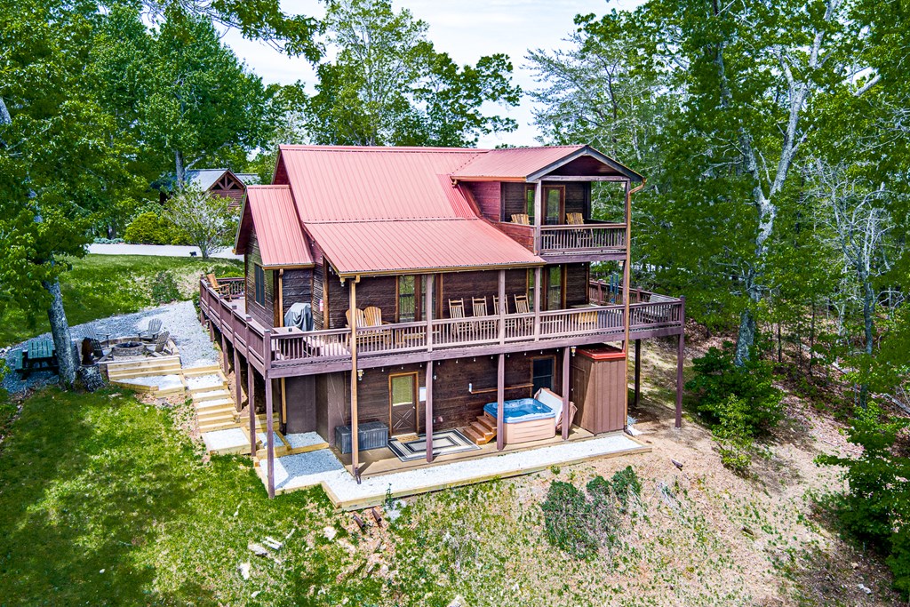 88 Black Gum Lane Blue Ridge, GA 30513 - Photo 56 of 85 a view of a house with a yard porch and sitting area