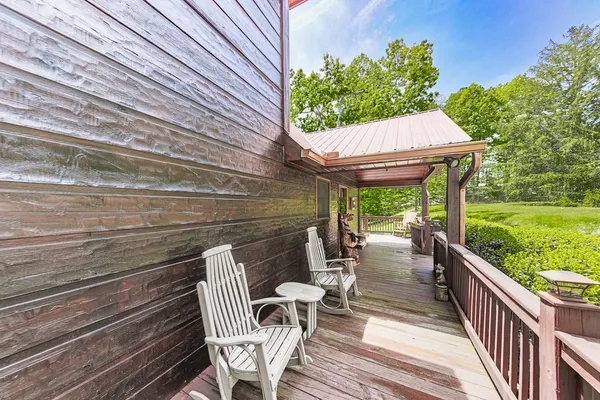 a view of a patio with a table and chairs