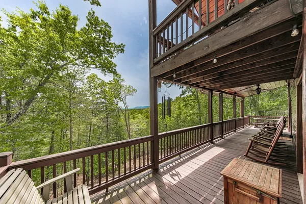 a view of a balcony with wooden floor