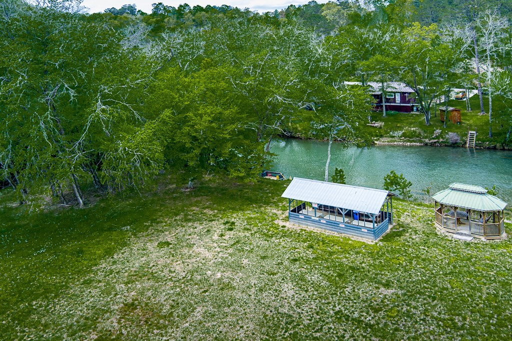 88 Black Gum Lane Blue Ridge, GA 30513 - Photo 81 of 85 a view of a lake with a building in the background