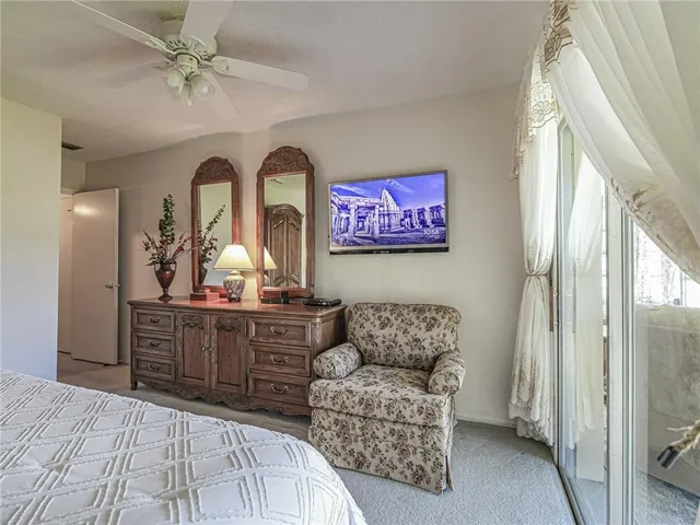 a bedroom with a bed and a lamp