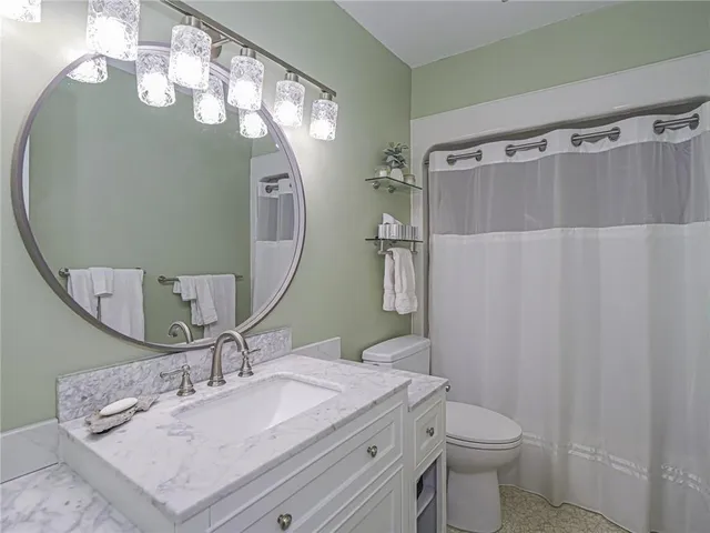 a view of a street with a car parked in front of it