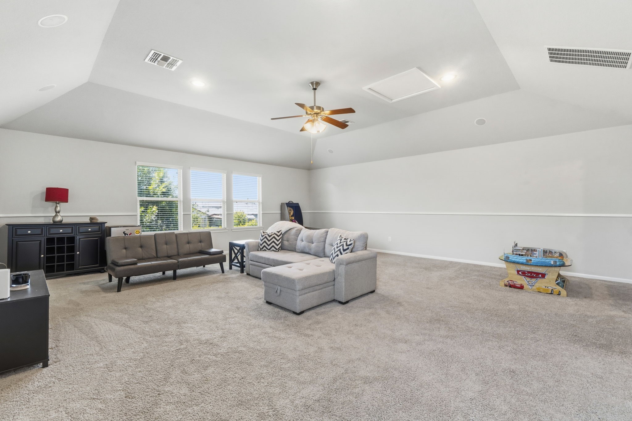 3900 Enchanted Timbers Lane Spring, TX 77386 - Photo 35 of 49 a living room with furniture and a chandelier