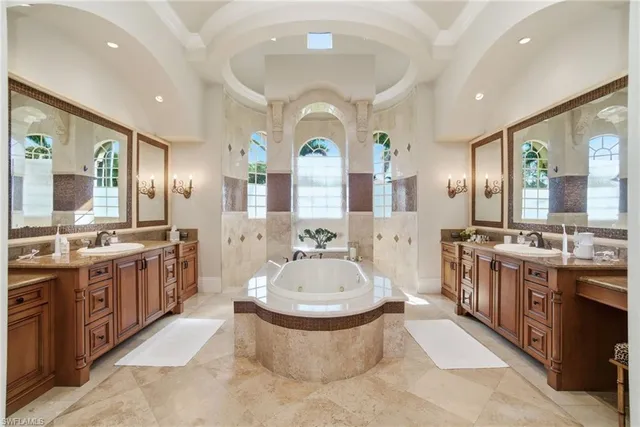 a bedroom with a bed a lamp and a dresser