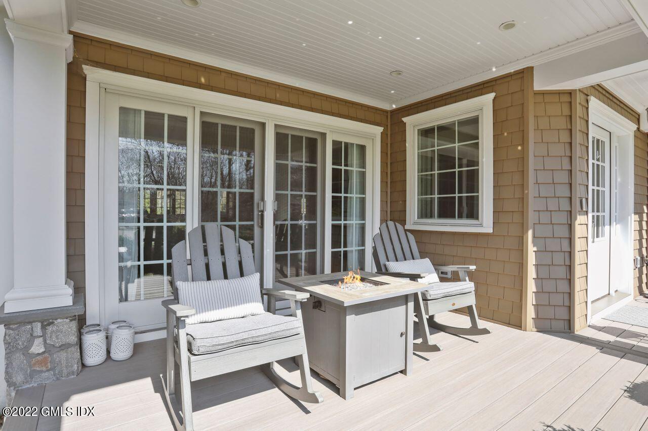 23 Mary Lane Riverside, CT 06878 - Photo 37 of 42 a building outdoor space with patio furniture and potted plants