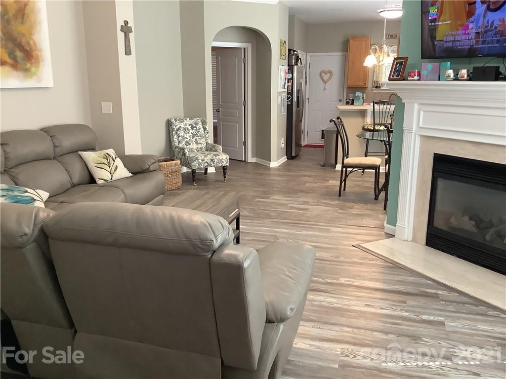 388 Sand Paver Way Fort Mill, SC 29708 - Photo 2 of 20 a living room with furniture and a fireplace