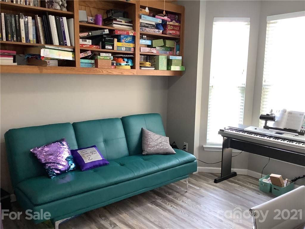 388 Sand Paver Way Fort Mill, SC 29708 - Photo 11 of 20 a living room with furniture and a book shelf