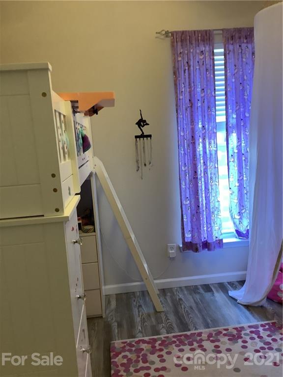 388 Sand Paver Way Fort Mill, SC 29708 - Photo 12 of 20 a view of a closet with wooden floor and a rug